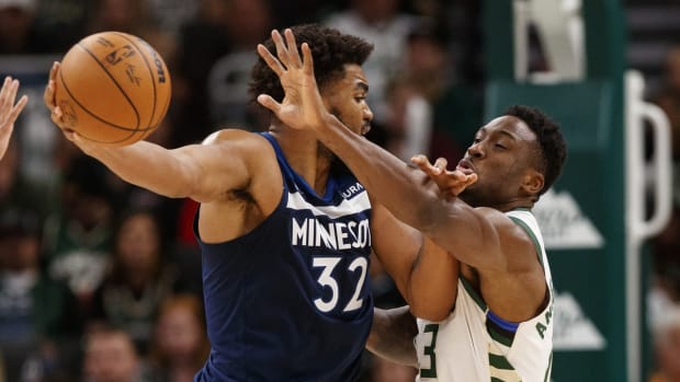 Oct 27, 2021; Milwaukee, Wisconsin, USA; Milwaukee Bucks forward Thanasis Antetokounmpo (43) defends Minnesota Timberwolves center Karl-Anthony Towns (32) during the third quarter at Fiserv Forum. Mandatory Credit: Jeff Hanisch-USA TODAY Sports